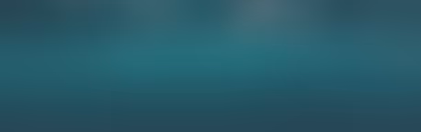 Blurred abstract background in shades of teal and dark blue.